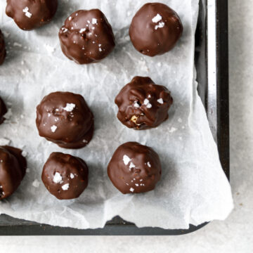 small bowl filled with fruit and nut chocolate balls