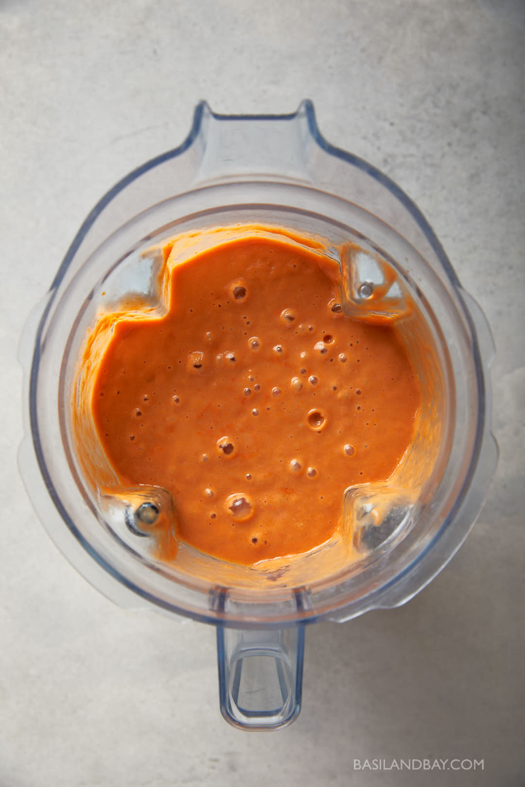 Smooth blended gazpacho in a blender jug, ready to chill