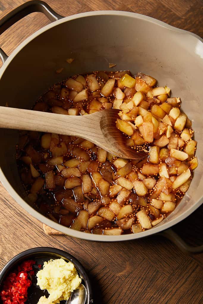 Image of cooked apples and raisins  mixture in a large saucepan