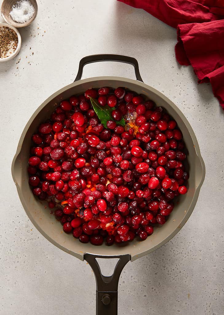 cranberry sweet chilli jam cranberries being added into the  pan