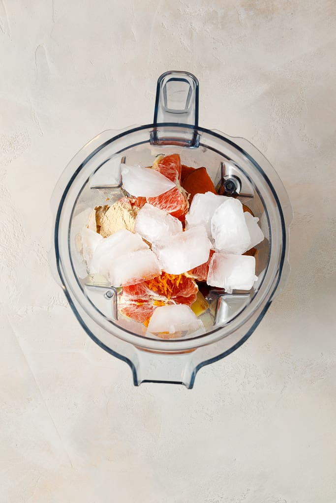 overhead shot of Sweet Potato & Cranberry Smoothie ingredients in a vitamix blender jug