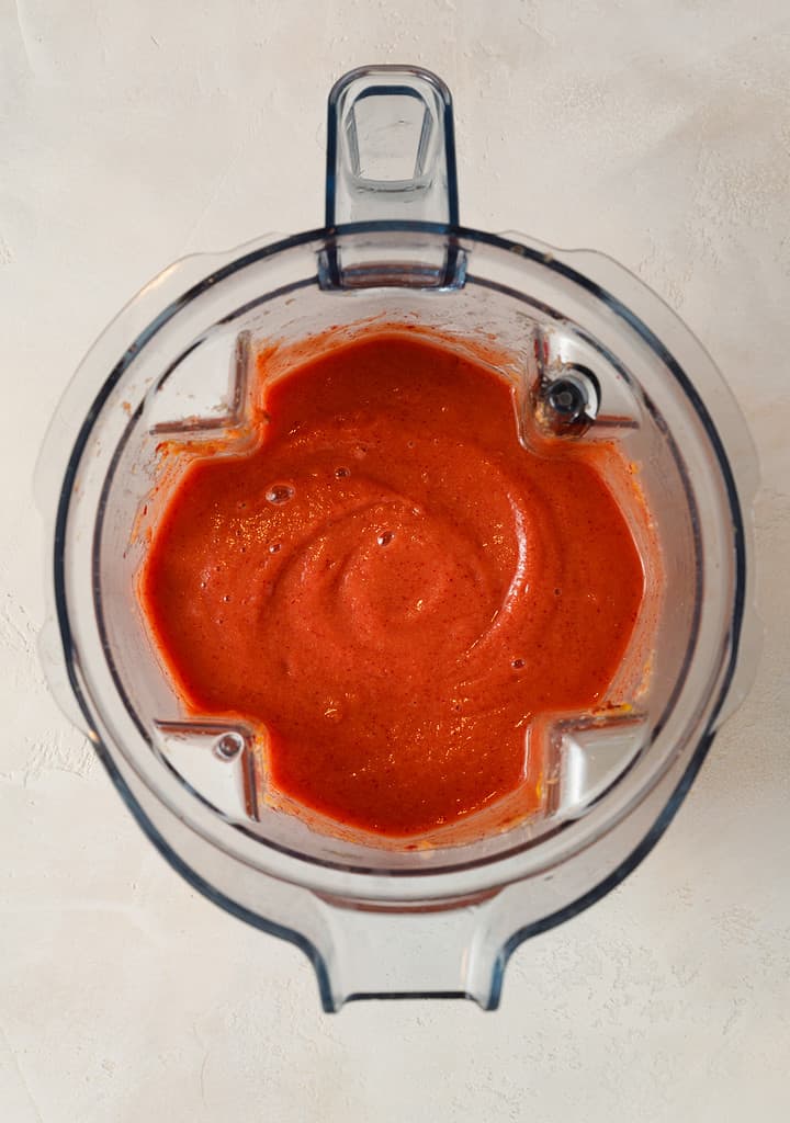 overhead shot of Vibrant Sweet Potato & Cranberry Superfood Smoothie blended in a vitamix blender jug