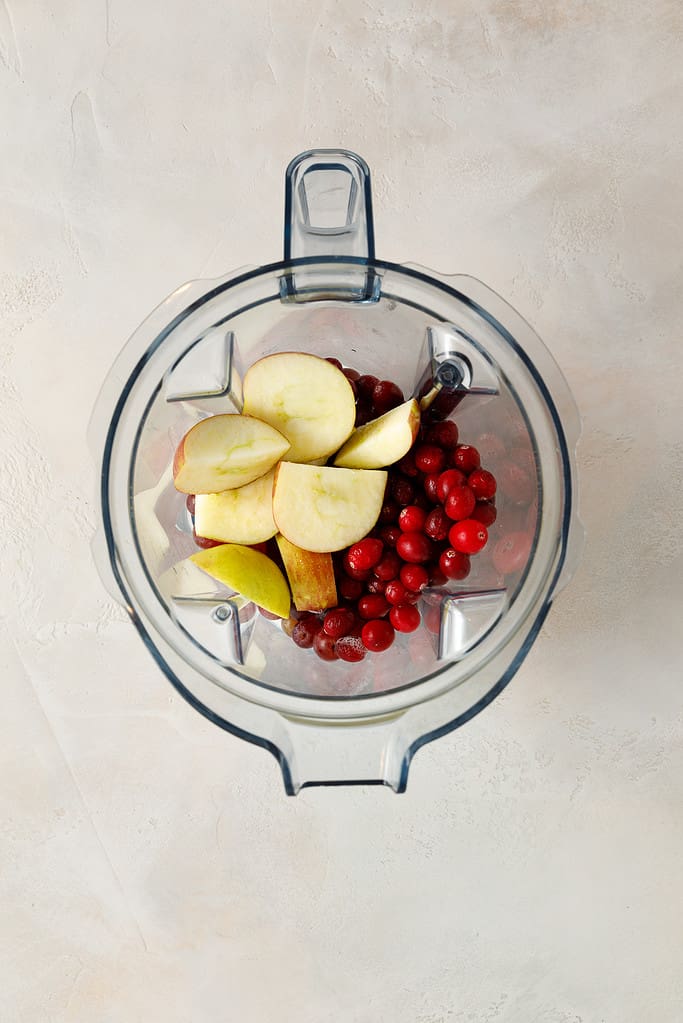 overhead shot of Sweet Potato & Cranberry Smoothie ingredients in a vitamix blender jug