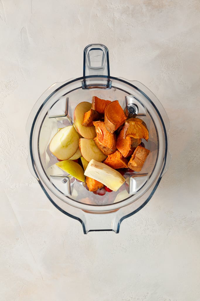 overhead shot of Sweet Potato & Cranberry Smoothie ingredients in a vitamix blender jug