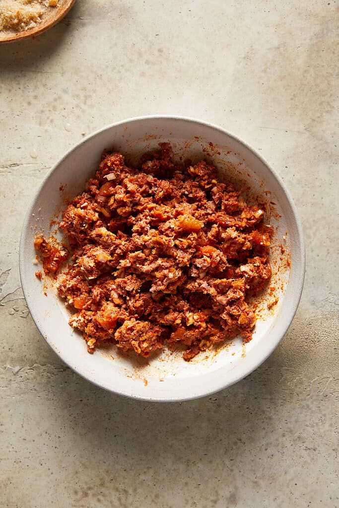 Step 3 of combining the ingredients needed for Spicy harissa vegan meatballs