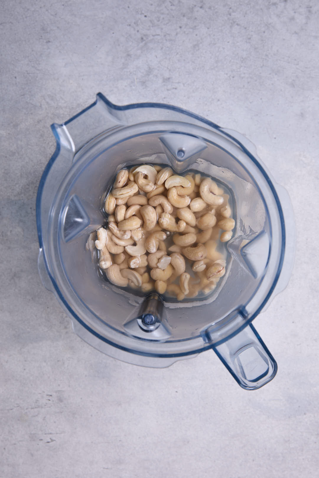 Cashews and water in a blender jug