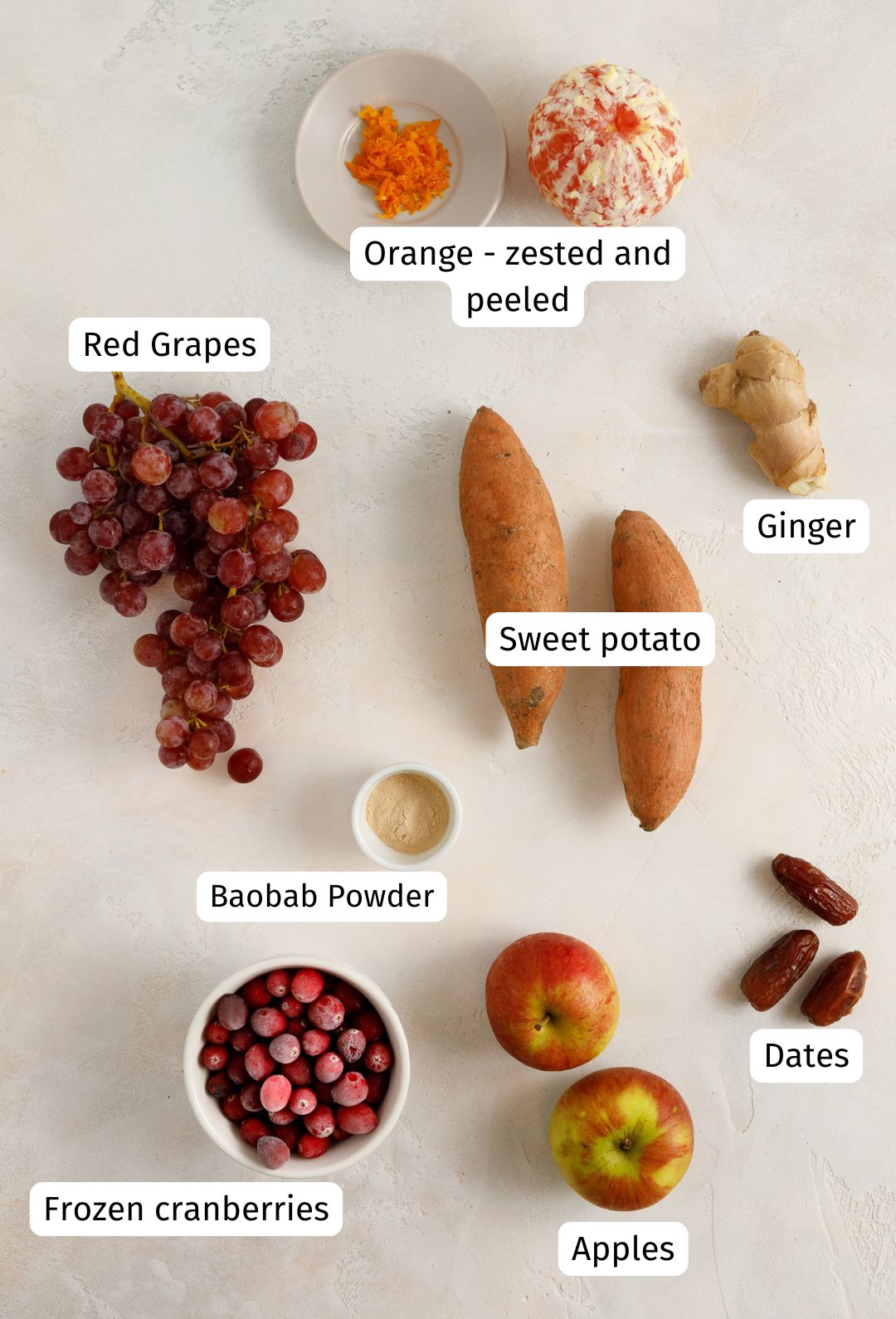 Ingredients for sweet potato smoothie on a cream textured surface